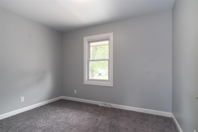 817 N Mohave Dr, Pontiac, IL 61764 - unfurnished room featuring dark carpet and baseboards
