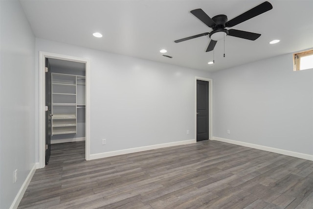 817 N Mohave Dr, Pontiac, IL 61764 - unfurnished bedroom featuring a walk in closet, wood finished floors, recessed lighting, and baseboards