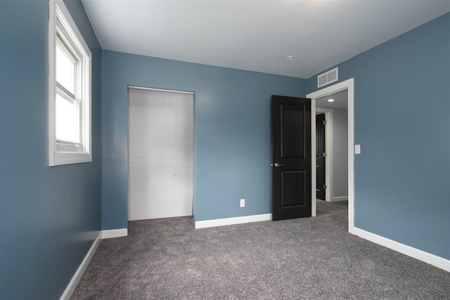 817 N Mohave Dr, Pontiac, IL 61764 - unfurnished bedroom featuring carpet and baseboards