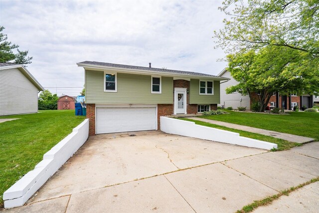 817 N Mohave Dr, Pontiac, IL 61764 - raised ranch with brick siding, an attached garage, concrete driveway, and a front yard