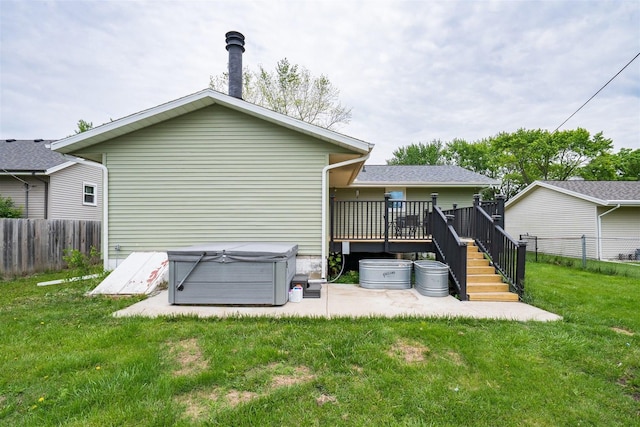 817 N Mohave Dr, Pontiac, IL 61764 - rear view of house featuring a hot tub, a wooden deck, and a patio area