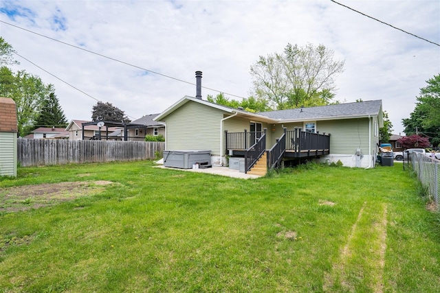 817 N Mohave Dr, Pontiac, IL 61764 - back of house featuring a hot tub and a wooden deck