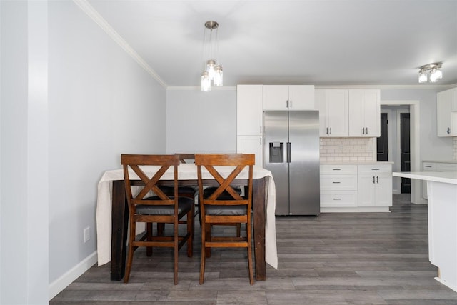 817 N Mohave Dr, Pontiac, IL 61764 - dining space with ornamental molding, wood finished floors, and baseboards