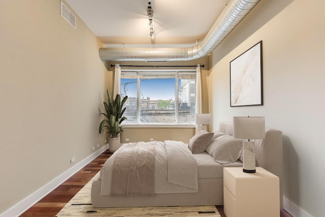 4751 N Artesian Ave Unit 206, Chicago, IL 60625 - bedroom featuring dark wood-type flooring and baseboards