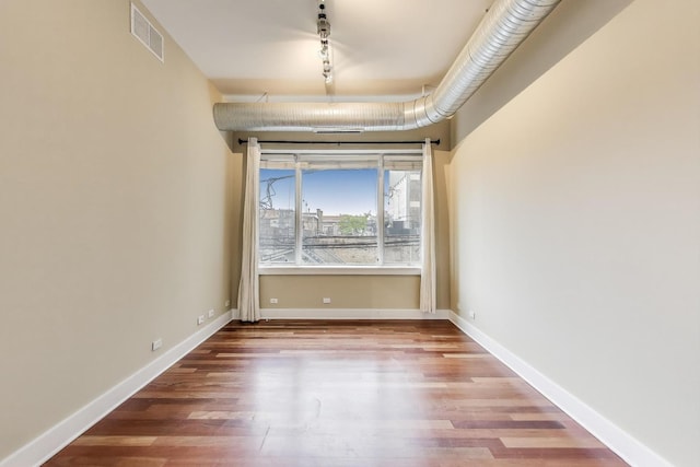 4751 N Artesian Ave Unit 206, Chicago, IL 60625 - empty room with wood finished floors and baseboards