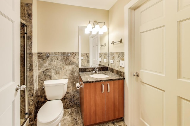 4751 N Artesian Ave Unit 206, Chicago, IL 60625 - full bath featuring toilet, tile walls, vanity, a shower stall, and a wainscoted wall