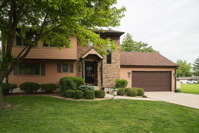 2148 Donahue St, Lasalle, IL 61301 - view of front of property featuring driveway, a front lawn, an attached garage, and stone siding
