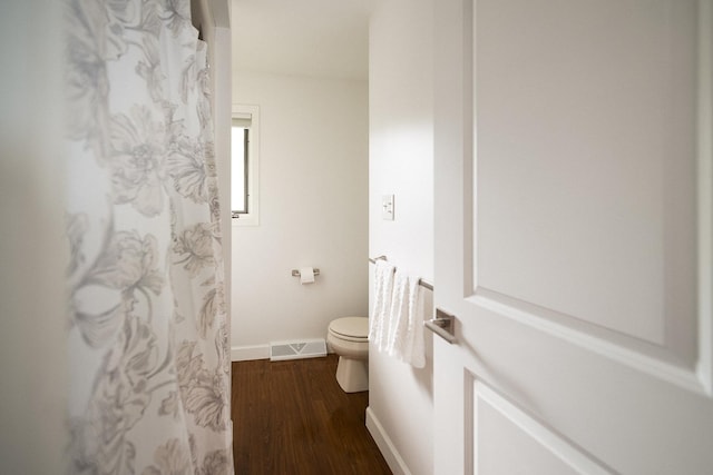 2148 Donahue St, Lasalle, IL 61301 - bathroom with toilet, wood finished floors, baseboards, and a shower with shower curtain