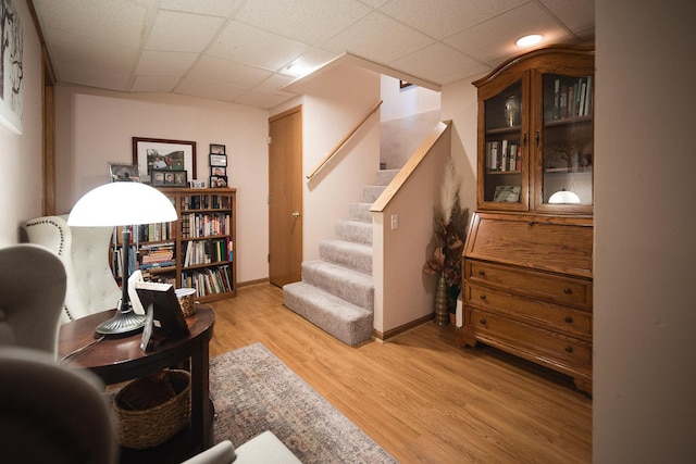 2148 Donahue St, Lasalle, IL 61301 - sitting room with stairway, light wood-type flooring, a paneled ceiling, and baseboards