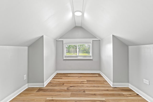 8837 S Morgan St, Chicago, IL 60620 - additional living space featuring vaulted ceiling, light wood-type flooring, and baseboards