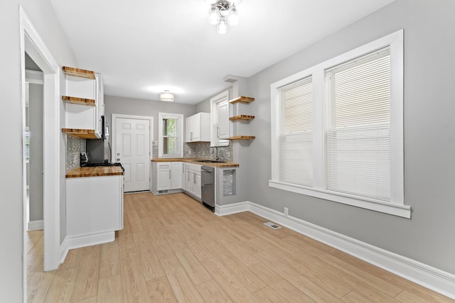 8837 S Morgan St, Chicago, IL 60620 - kitchen with open shelves, stainless steel dishwasher, a sink, white cabinets, and tasteful backsplash