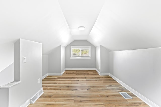 8837 S Morgan St, Chicago, IL 60620 - bonus room featuring light wood finished floors, lofted ceiling, and baseboards
