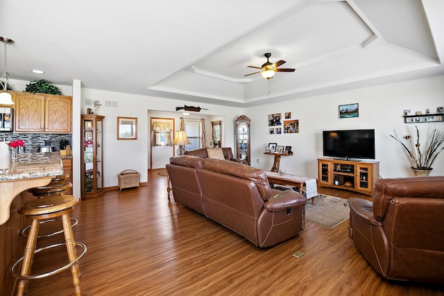 2609 E 1500s Rd, Kankakee, IL 60901 - living room featuring a raised ceiling, dark wood finished floors, a ceiling fan, recessed lighting, and baseboards