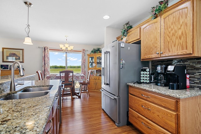 2609 E 1500s Rd, Kankakee, IL 60901 - kitchen with a sink, high end fridge, a chandelier, wood finished floors, and light stone counters