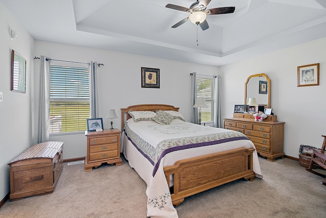 2609 E 1500s Rd, Kankakee, IL 60901 - bedroom with a tray ceiling, light colored carpet, baseboards, and a ceiling fan