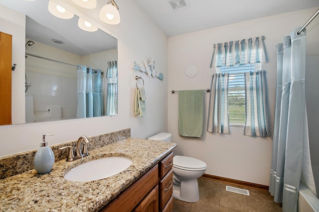2609 E 1500s Rd, Kankakee, IL 60901 - bathroom featuring toilet, vanity, curtained shower, tile patterned floors, and baseboards