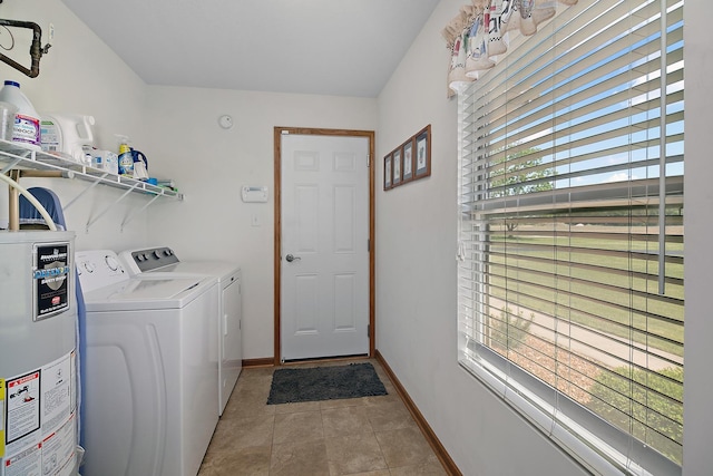 2609 E 1500s Rd, Kankakee, IL 60901 - washroom featuring gas water heater, washing machine and dryer, light tile patterned floors, and baseboards