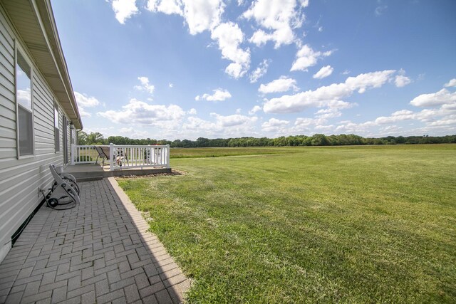 2609 E 1500s Rd, Kankakee, IL 60901 - view of green lawn featuring a deck and a view of rural / pastoral area