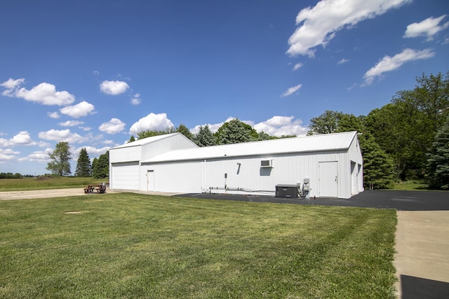 2609 E 1500s Rd, Kankakee, IL 60901 - view of side of property featuring a yard, central AC, and an outbuilding