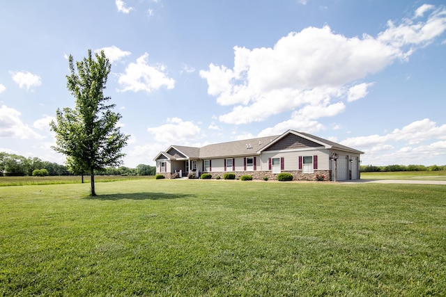 2609 E 1500s Rd, Kankakee, IL 60901 - single story home with a garage, driveway, a front lawn, and stone siding