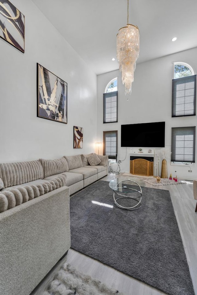 17964 Upland Dr, Tinley Park, IL 60487 - living room with wood finished floors, a chandelier, recessed lighting, and a towering ceiling