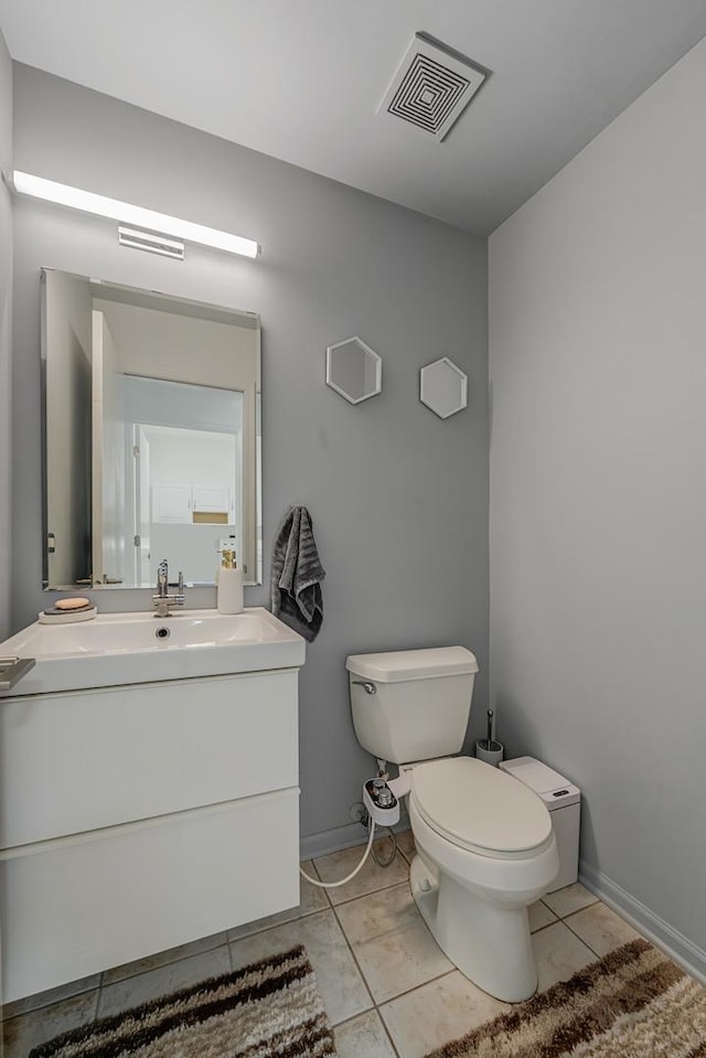 17964 Upland Dr, Tinley Park, IL 60487 - half bathroom with toilet, vanity, tile patterned flooring, and baseboards