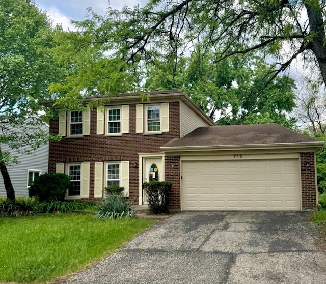716 Shining Water Dr, Carol Stream, IL 60188 - colonial home with brick siding, driveway, and an attached garage