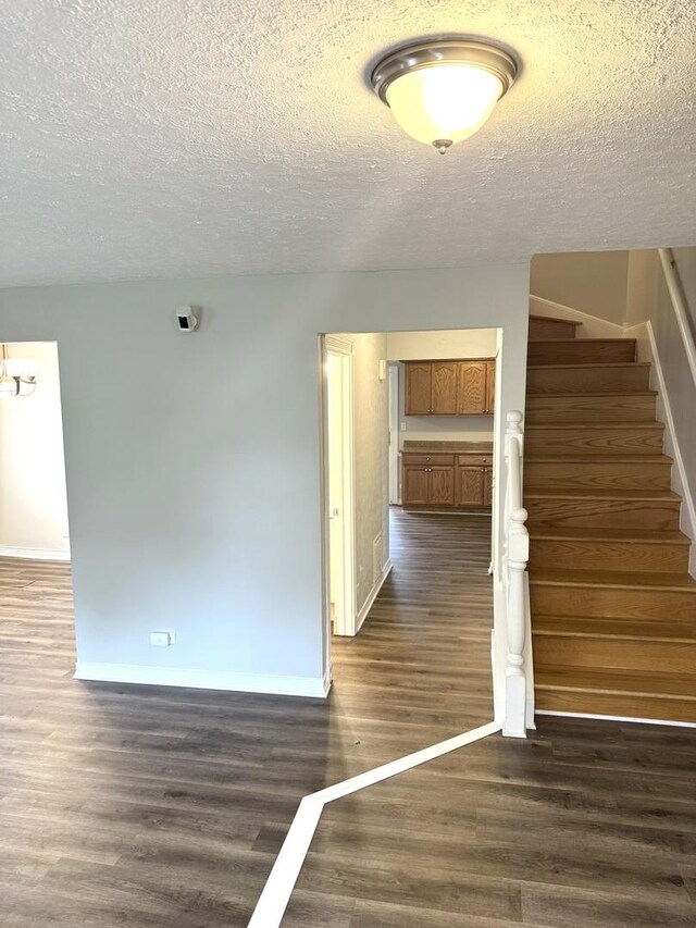 716 Shining Water Dr, Carol Stream, IL 60188 - staircase featuring a textured ceiling and wood finished floors