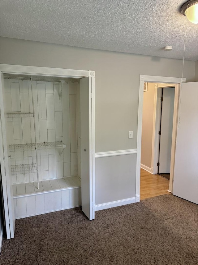 716 Shining Water Dr, Carol Stream, IL 60188 - unfurnished bedroom with carpet flooring and a textured ceiling