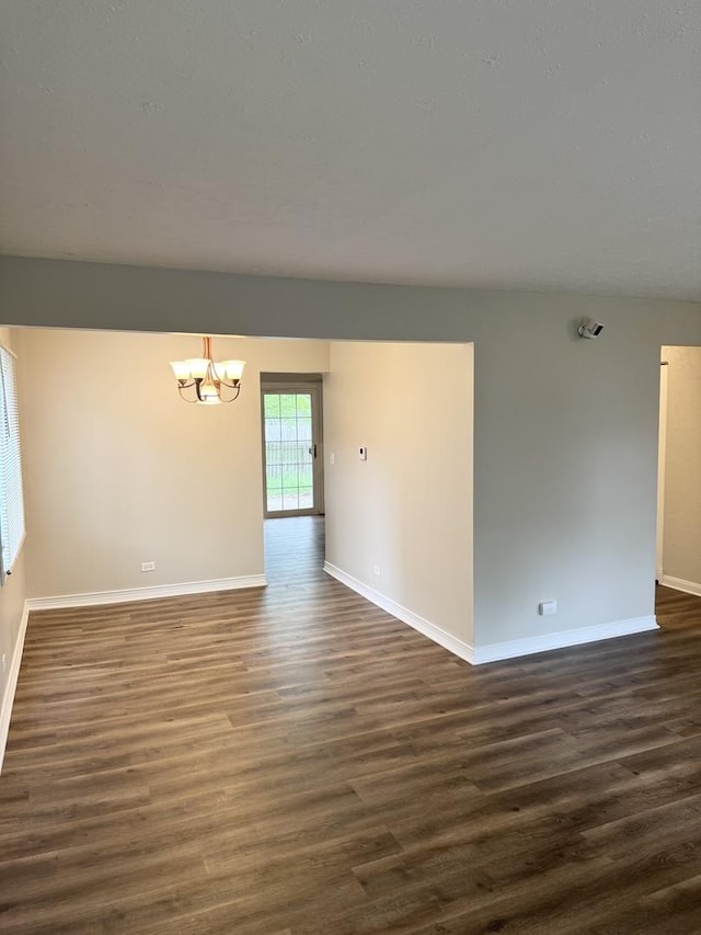 716 Shining Water Dr, Carol Stream, IL 60188 - unfurnished room with dark wood finished floors and a chandelier