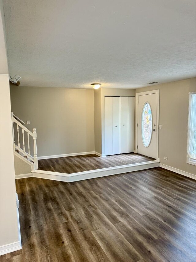 716 Shining Water Dr, Carol Stream, IL 60188 - entryway featuring wood finished floors, stairway, and a textured ceiling