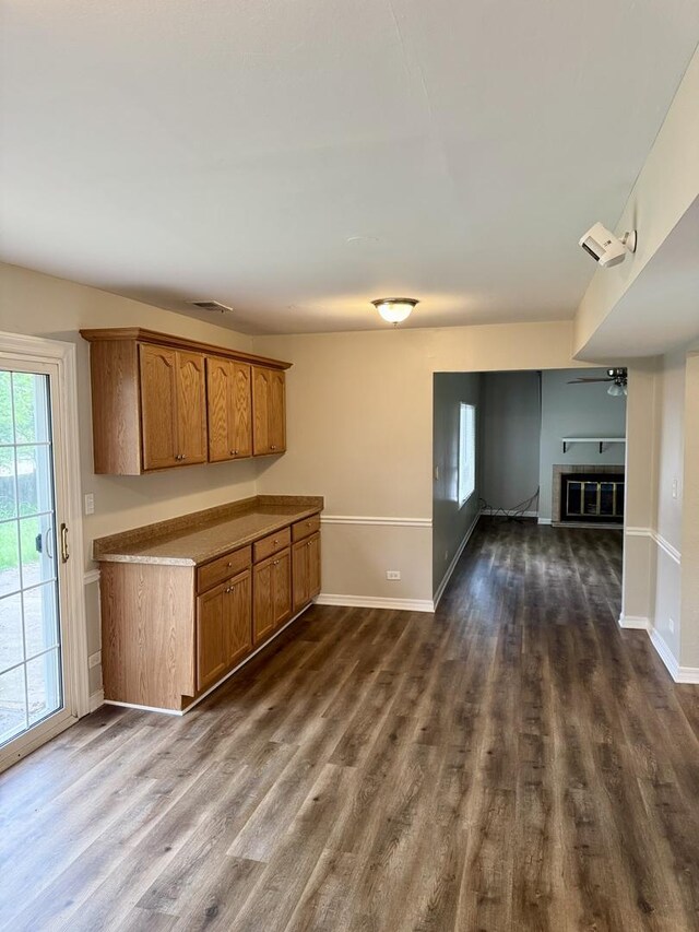 716 Shining Water Dr, Carol Stream, IL 60188 - kitchen featuring brown cabinetry, dark wood finished floors, open floor plan, and ceiling fan