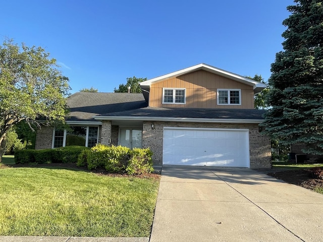 13153 W Pin Oak Dr, Homer Glen, IL 60491 - view of front facade with driveway, an attached garage, a front yard, and brick siding