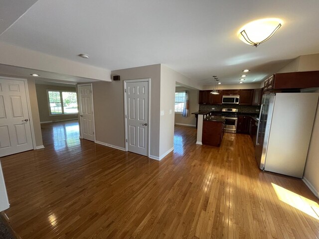 13153 W Pin Oak Dr, Homer Glen, IL 60491 - kitchen featuring stainless steel appliances, open floor plan, dark wood-style floors, and recessed lighting
