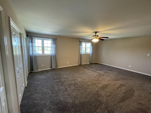 13153 W Pin Oak Dr, Homer Glen, IL 60491 - unfurnished bedroom featuring multiple windows, dark colored carpet, and baseboards