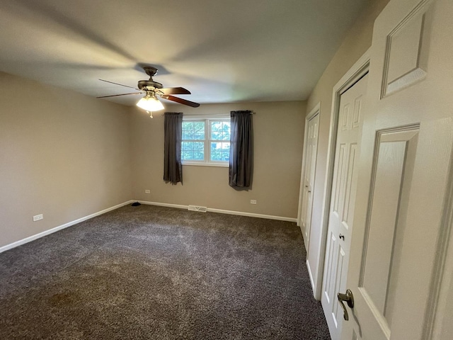 13153 W Pin Oak Dr, Homer Glen, IL 60491 - unfurnished bedroom with dark colored carpet, baseboards, and ceiling fan