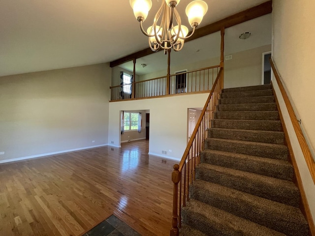 13153 W Pin Oak Dr, Homer Glen, IL 60491 - staircase featuring wood finished floors, a chandelier, baseboards, high vaulted ceiling, and beam ceiling