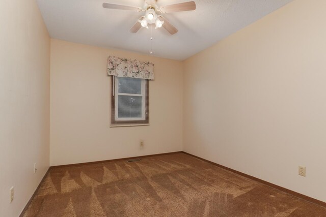 1560 Hunt Dr Unit A, Normal, IL 61761 - spare room featuring carpet flooring, ceiling fan, and baseboards