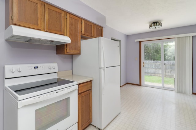 1560 Hunt Dr Unit A, Normal, IL 61761 - kitchen featuring white appliances, under cabinet range hood, light countertops, and brown cabinetry