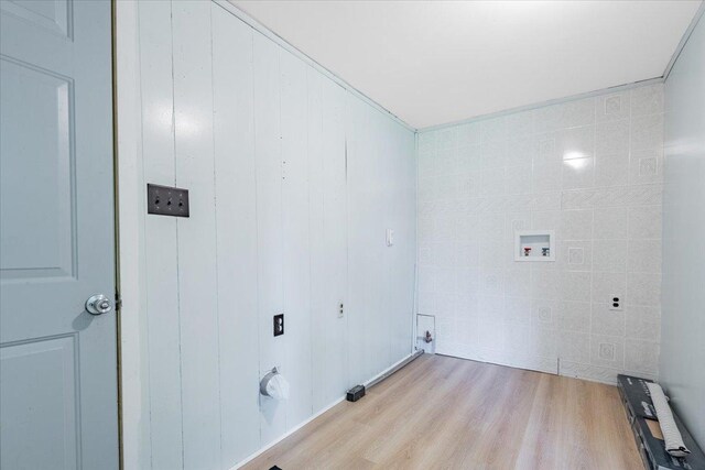 323 N 2nd Ave, Chenoa, IL 61726 - laundry area with radiator heating unit, washer hookup, and light wood-style floors