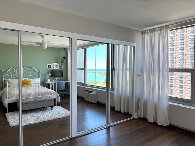 3600 N Lake Shore Dr Unit 2212, Chicago, IL 60613 - bedroom with multiple windows, dark wood finished floors, and a desk