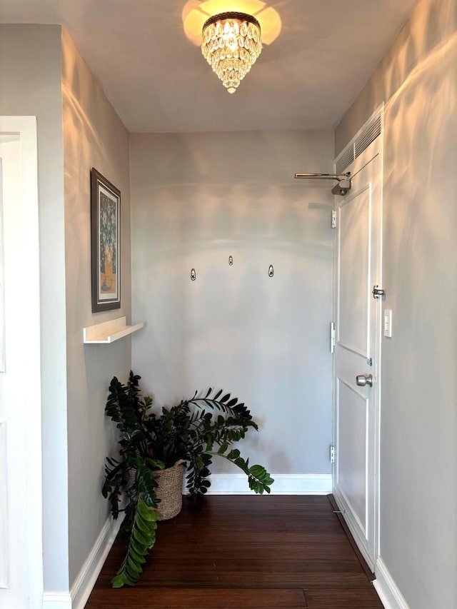 3600 N Lake Shore Dr Unit 2212, Chicago, IL 60613 - hall with wood finished floors, baseboards, and a chandelier