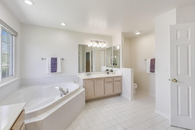 1400 Patrick Dr, Mundelein, IL 60060 - bathroom with double vanity, a garden tub, toilet, tile patterned flooring, and recessed lighting