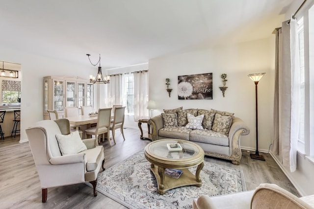 1400 Patrick Dr, Mundelein, IL 60060 - living area featuring a chandelier, plenty of natural light, wood finished floors, and baseboards