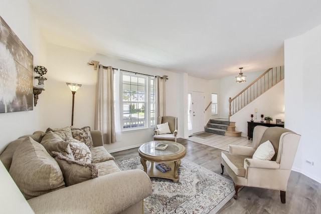 1400 Patrick Dr, Mundelein, IL 60060 - living room with stairs, wood finished floors, a chandelier, and baseboards