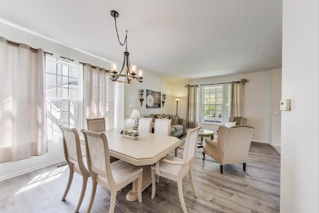1400 Patrick Dr, Mundelein, IL 60060 - dining space with a chandelier, light wood-style flooring, and baseboards