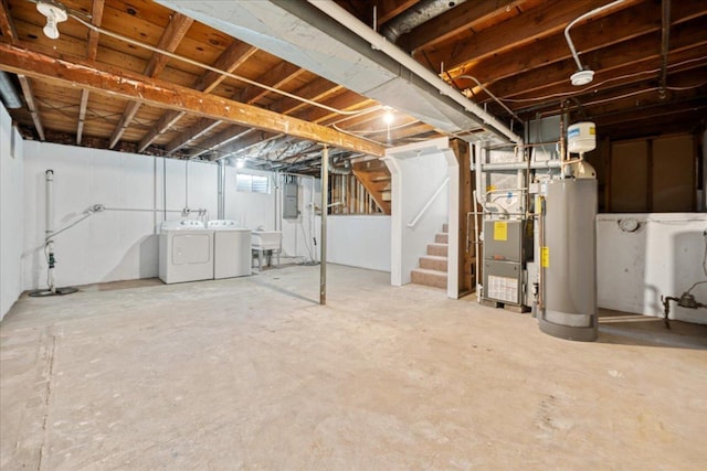 603 Geddes Ave, Winthrop Harbor, IL 60096 - unfinished below grade area featuring washer and clothes dryer, gas water heater, stairway, electric panel, and heating unit