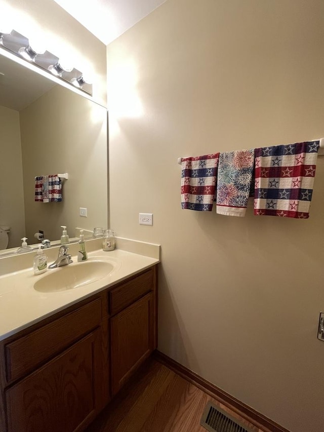 749 S Vintage Ln, Round Lake, IL 60073 - bathroom with vanity, toilet, and wood finished floors