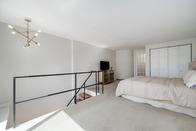 1221 N Dearborn St Unit 601S, Chicago, IL 60610 - bedroom with carpet floors, a chandelier, and a closet