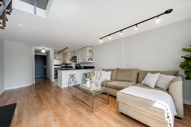 1221 N Dearborn St Unit 601S, Chicago, IL 60610 - living room featuring track lighting, light wood-type flooring, and baseboards